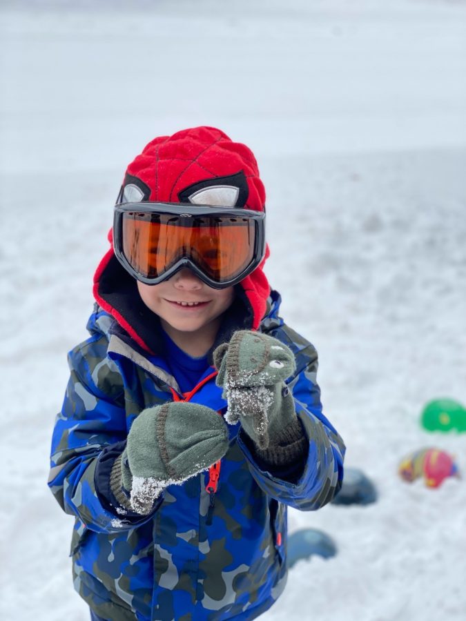 My other Becket, who is 5 years old. This was his First time seeing snow and he loves it!