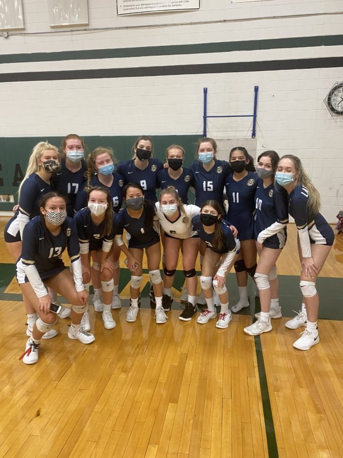 Lafayette's Varsity Volleyball team poses in their masks after their 3-0 victory against Jamestown. This was the first time since 2009 that LHS beat JHS.