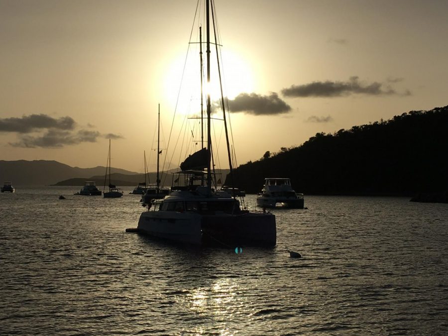 Jumping off the top of our sailboat, we would stare at the sun setting over the luxurious hills of the island. Unforgettable sunset, paddle boarding, and swimming experiences flooded this trip. Swimming at sunset was ominous because the bottom of the ocean is not visible because the sunlight just reflects. The song “Escape (The Pina Colada Song),” by Rupert Holmes was blasting from the speakers as we splashed into the sunlit water at dusk.    