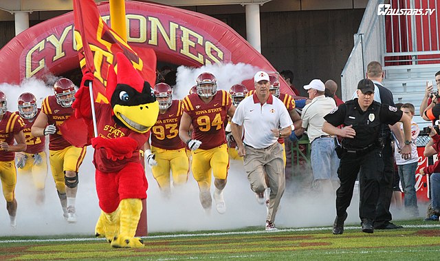 September 1, 2012; Ames, IA, USA;  Iowa State Cyclones wide receiver Tobais Palmer (4) runs after a catch and avoids the tackle by Tulsa Golden Hurricanes defensive back Byron Moore (3) in the first quarter at Jack Trice Stadium. 