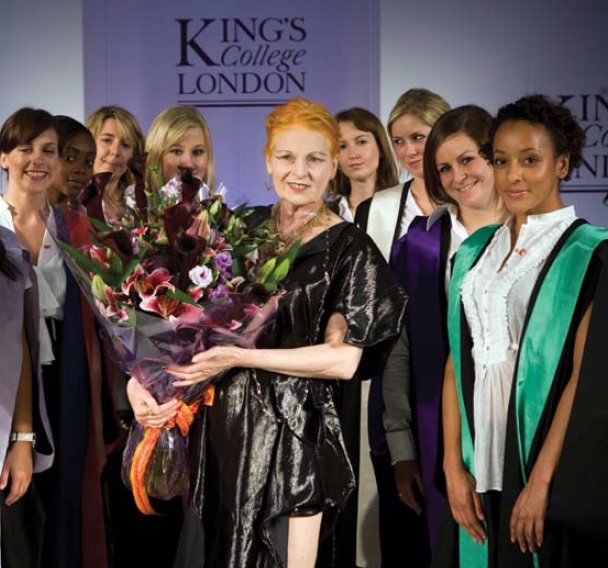 Vivienne holding a bouquet of flowers after the unveiling of the new academic gowns of King's College, which she designed.