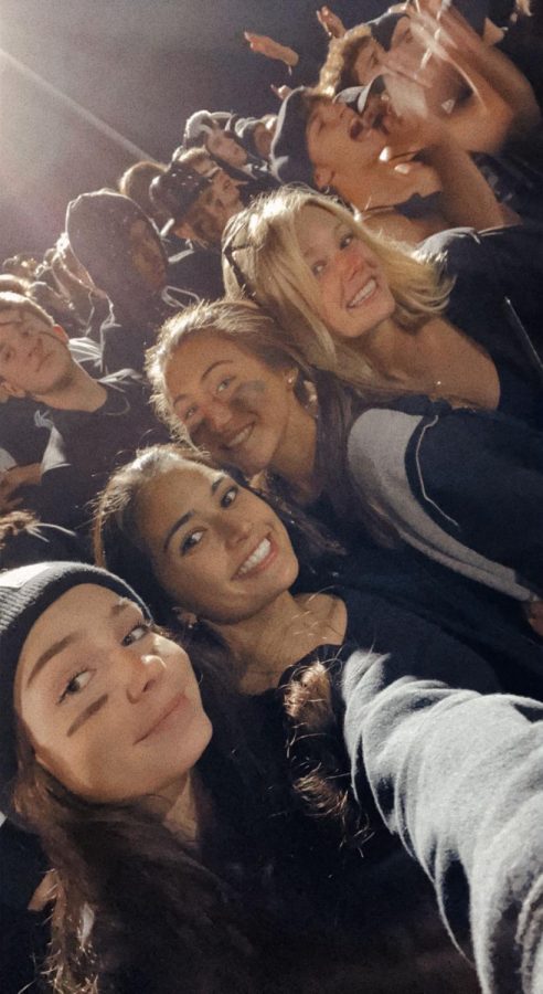 Girls gather at the black out football game to support the rams. Left to right: Ana Britton, Jacy Ramos, Clara Burgess, Katie Motes