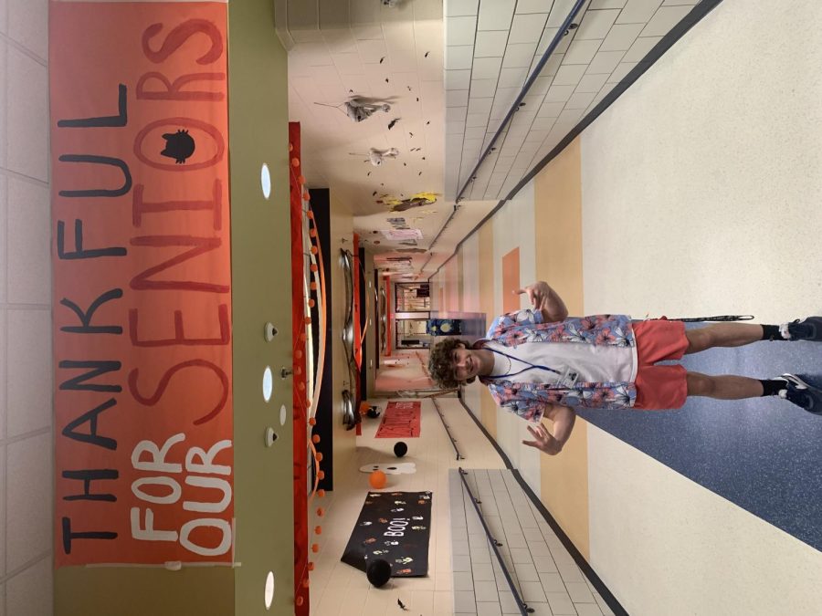 Standing student, Colby Franken, is one of many students who walk under this sign everyday. Colby is a senior this year. Along with his other senior comrades he is appreciative to see a sign like this recognizing his class.