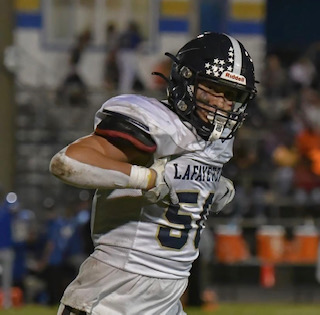 Hudson celebrating after running back, Braden Smalls ran the ball in for a touchdown. 