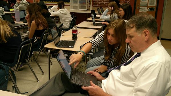 Mr. Rice, LHS principal, collaborates with Skyla to navigate the ship database about the Transatlantic Slave trade.