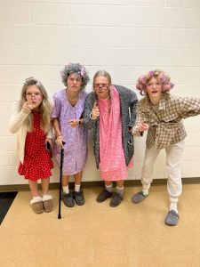  Group of students dressed up as seniors for Spirit Week.