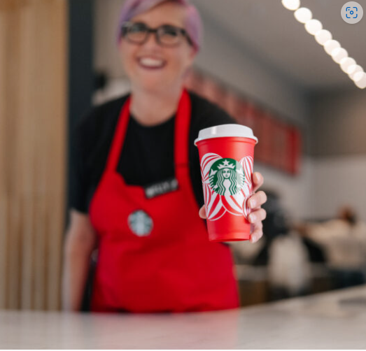 Starbucks employe sharing her joy with their new cup design