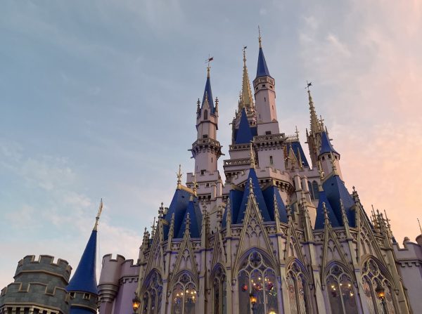 The infamous Cinderella Castle of Walt Disney World sits in the dusk of the afternoon, waiting in all its beauty for the sky to darken and its lights to illuminate.