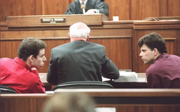 Erik Menendez, Left, Lyle Menendez, Right, conversing during a heart beating trial. (Kim Kulish)
