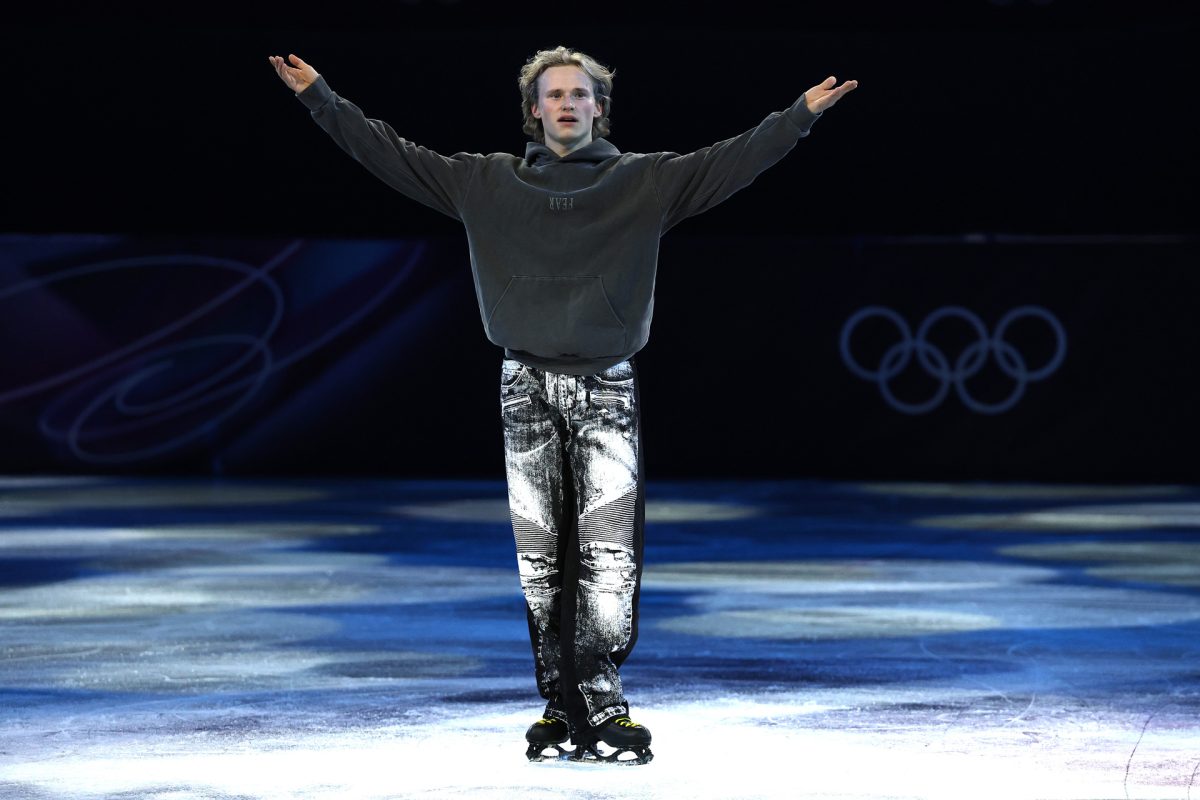 The "Quad God" salutes his audience after a stunning exhibition skate.