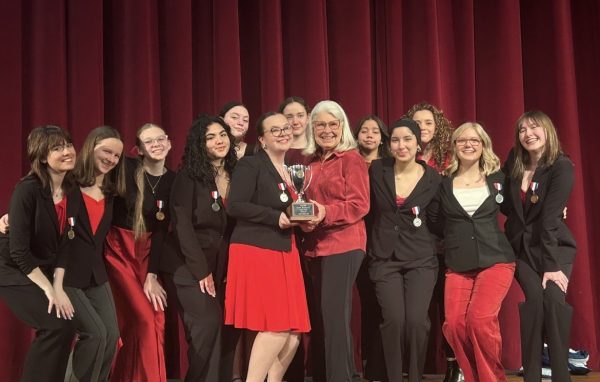 The LHS Speech team poses with their award.