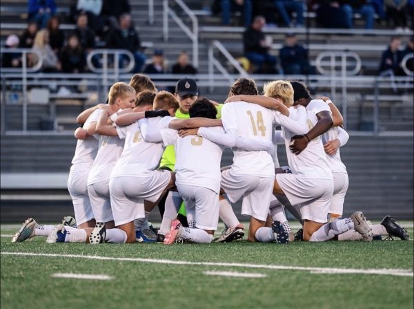 The Lafayette Rams huddle up to discuss a game plan.
