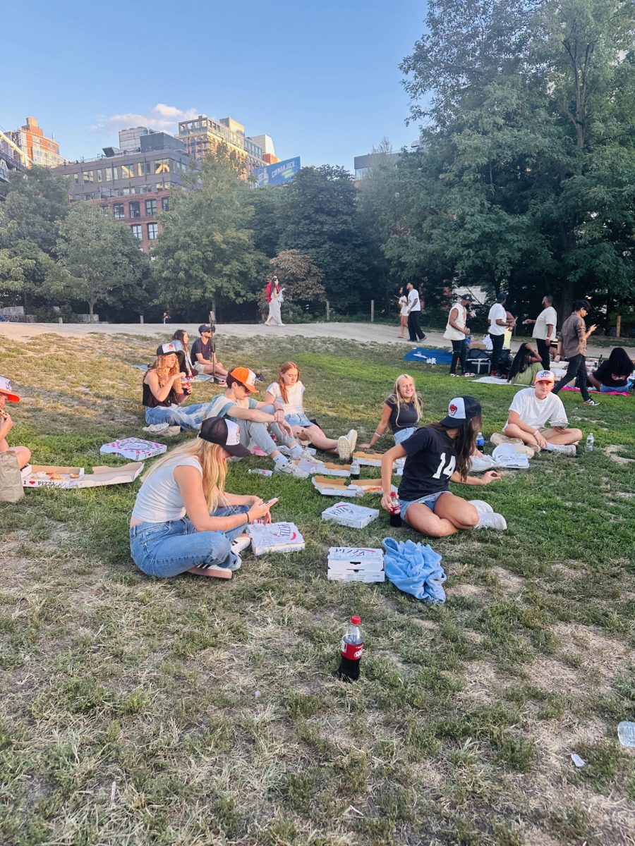 After a walk across the Brooklyn Bridge in NYC, friends enjoy dinner eating authentic New York pizza